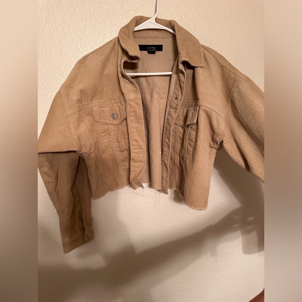 Corduroy style tan jacket cropped.
